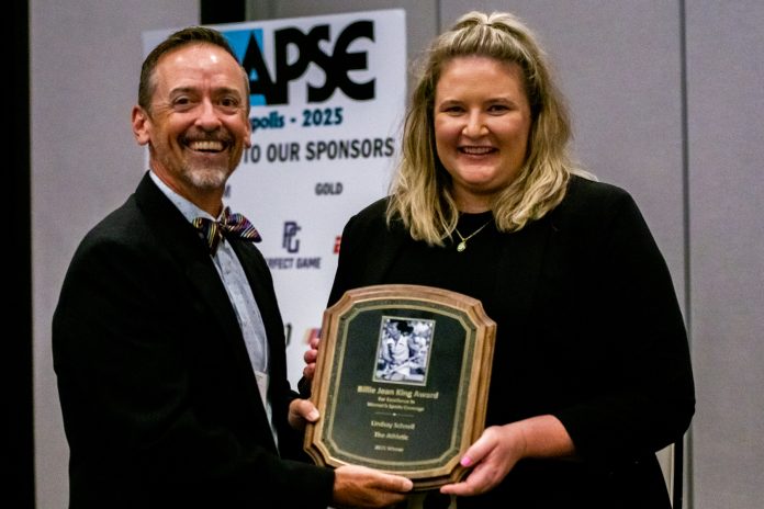 Lindsay Schnell receives the 2025 Billie Jean King Award for Excellence in Women’s Sports Coverage from APSE President Dan Spears at the APSE Summer Conference in Minneapolis on June 28, 2025.