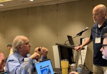 APSE opens 2026 Summer Conference with record sponsorship, membership gains Former APSE president Mike Sherman speaks with current APSE president Paul Barrett and first vice president Perryn Keys at the opening meeting in Arlington, Virginia, on July 16, 2026.